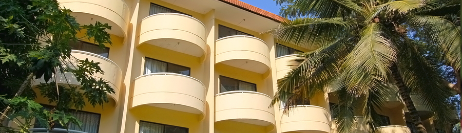 receptionist with headset and business people in background